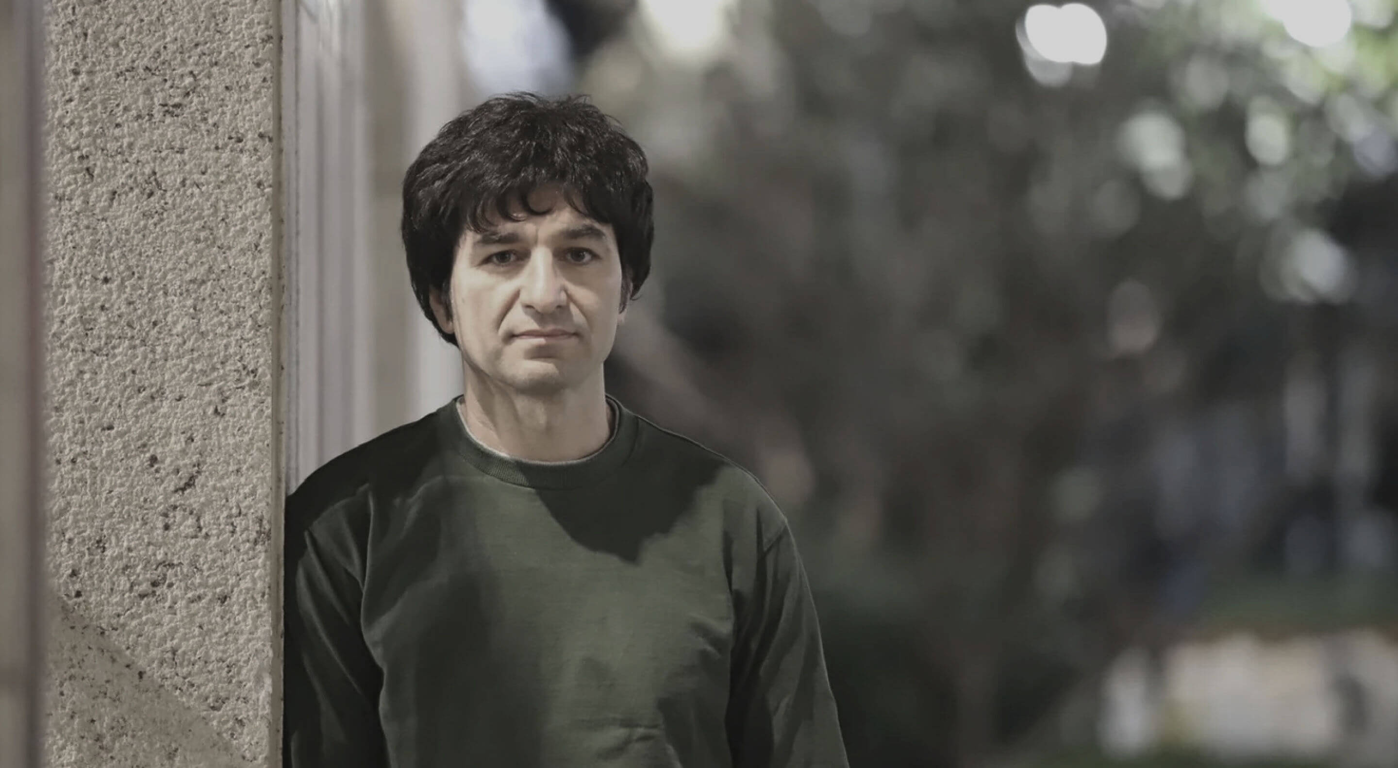 Portrait photo of John Outsider standing outside